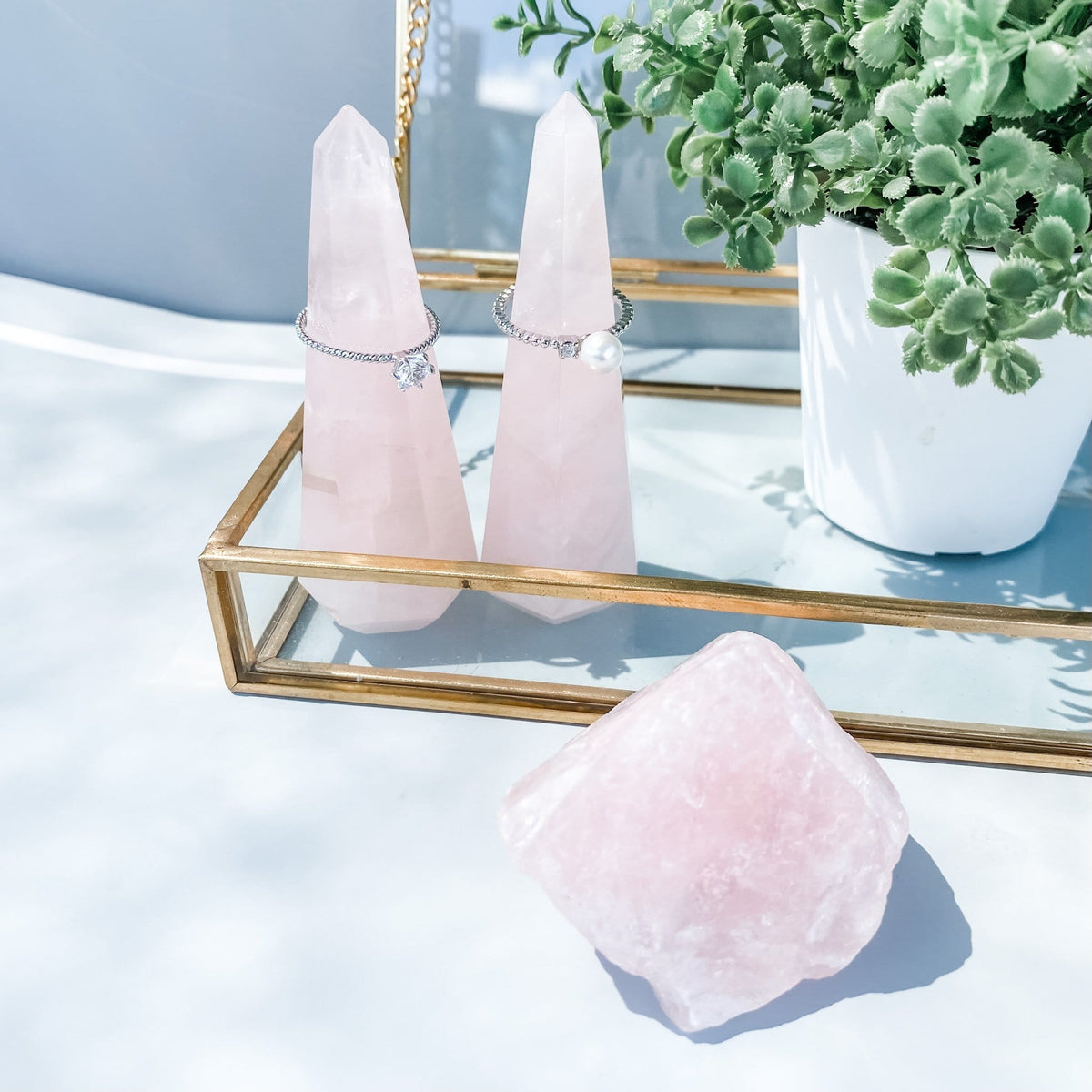 Rose quartz crystal ring stand ring holder tower point generator gemrox australia