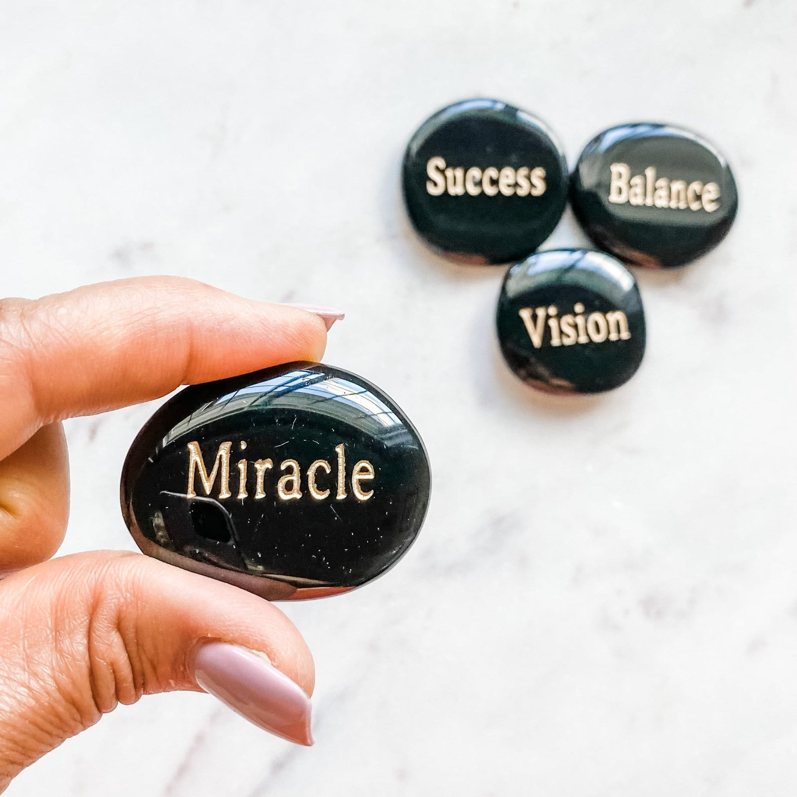 Black onyx inspirational engraved word palmstone miracle