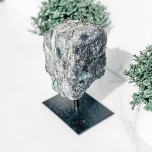 S1766 Raw Emerald crystal stone on black metal stand australia. emerald on a stand home office decor australia. gemrox sydney 1