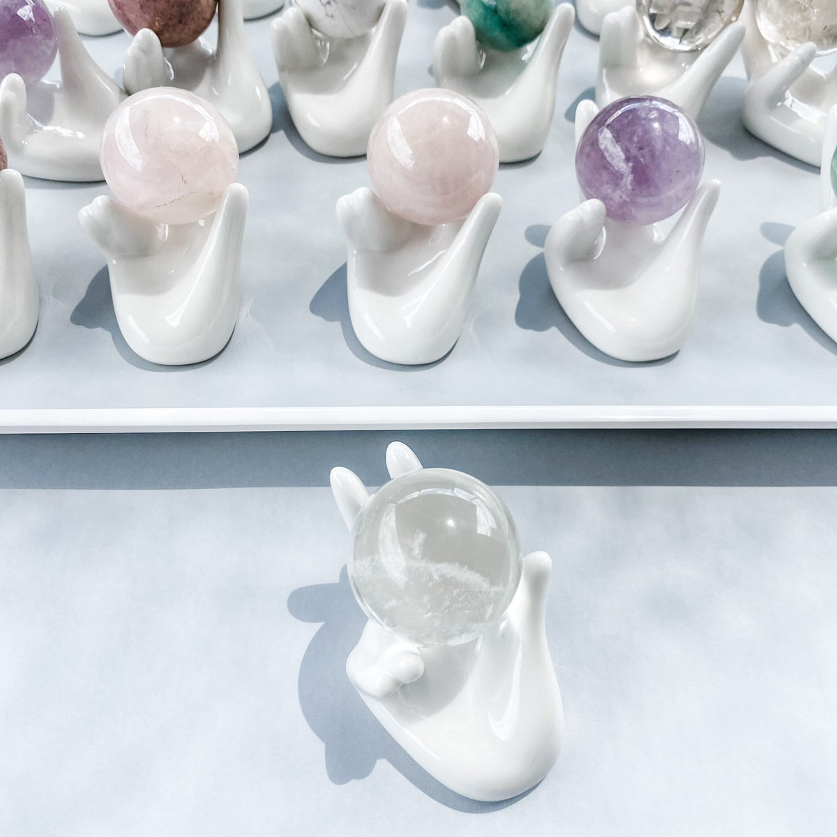 white ceramic hand shaped crystal sphere holder gemrox australia
